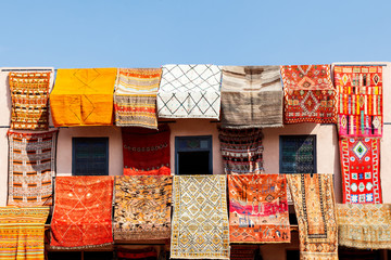 arpets Hanging on a roof for Sale at a Market in Marrakech Marroco