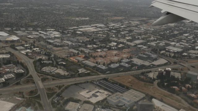Aerial view of San Jose Suburbs out of plane window 4k