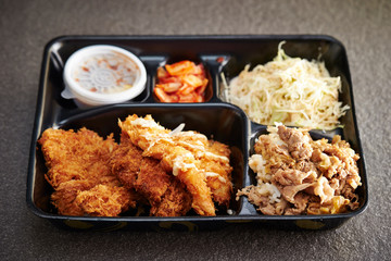 Mixed deep fried dishes in lunch box 