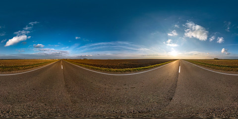 Fototapeta na wymiar full seamless spherical hdri panorama 360 degrees angle view on ashault road among fields in autumn evening with beautiful clouds in equirectangular projection, ready for VR AR virtual reality content