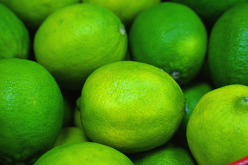 fresh organic limes as background