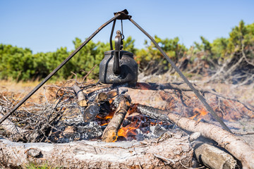 kettle basked on a fire