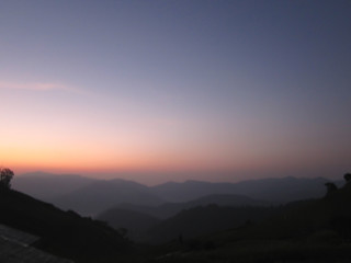 Landscape of mountain, beautiful twilight sky during sunrise for relaxing travel destination in Thailand in winter season.