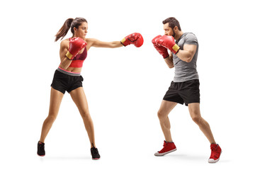 Young man and woman boxing