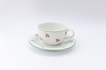 Porcelain coffee or tea mug with cherry pattern isolated - retro midcentury classic cup - mass product china ware