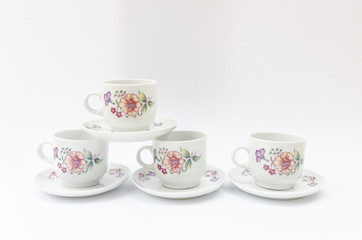 Porcelain coffe or tea cups with floral pattern isolated - retro midcentury classic mass product china ware
