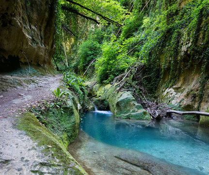 Valley of the Alento river in Serramonacesca (Italy): small lake bordered by the path