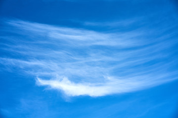 Spindrift сlouds in bright blue sky