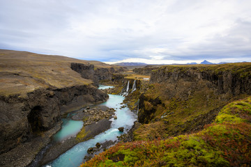 Obraz premium Beautiful landscape of Sigoldugljufur canyon with many small waterfalls and the blue river in Highlands of Iceland