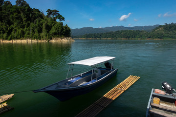 fiber speed boat floating near the boathouse.boat is main transportation at Banding Lake located in Perak State, Malaysia