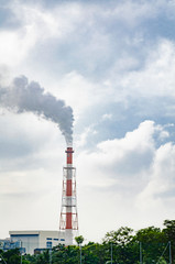 Fototapeta na wymiar Air pollution from power plant chimneys, cloudy sky background