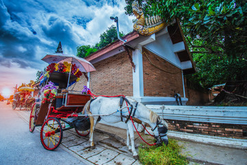 Fototapeta na wymiar Carriages in front of Wat Phra That Lampang Luang, designed for tourist services.