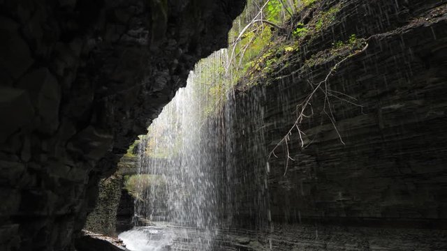 Watkins Glen State Park moving under water fall in beautiful deep natural gorge 01