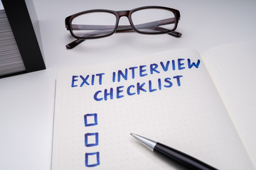 Exit Interview Checklist Message On Notebook