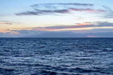 Calm Blue Waters With A Beautiful Orange Sky At Sunset On Las Americas Beach. April 11, 2019. Santa Cruz De Tenerife Spain Africa. Travel Tourism Street Photography.