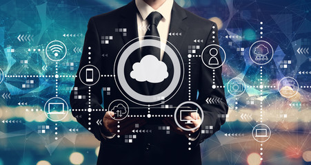 Cloud computing with businessman holding a tablet computer