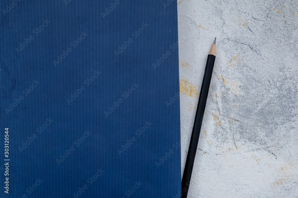 Wall mural A vintage cloth book with pensil cover with a blue screen pattern and grunge background texture