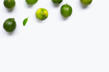 Limes with leaf isolated on white
