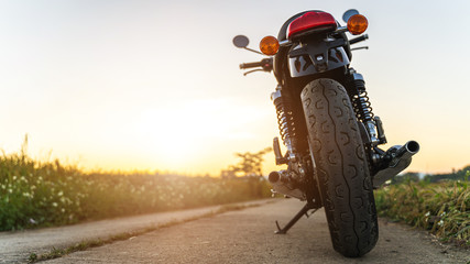motorcycle in a sunny motorbike on the road. with sunset light. copyspace for your individual text. 