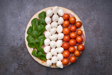 Raw Cheese, Pepperoni And Vegetables Topping On Pizza Base