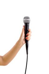 Woman's hand holding a microphone isolated on white background