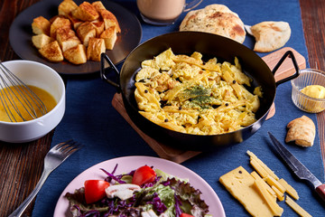 cramble Egg Roomy Cheese in frying pan