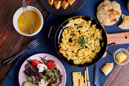 cramble Egg Roomy Cheese in frying pan