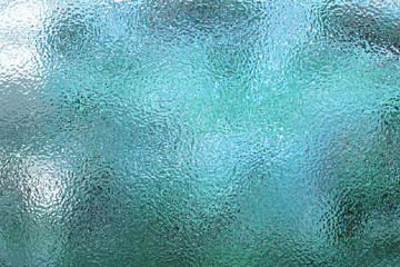 Light blue matte surface. Wet plastic glass. Frosted winter window glass - obrazy, fototapety, plakaty