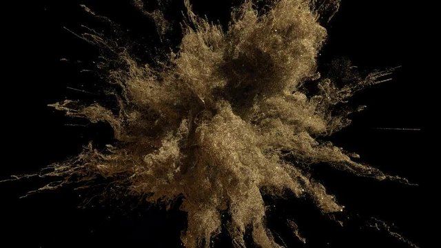 Cg animation of gold powder explosion on black background. Slow motion movement with acceleration in the beginning. Has alpha matte.