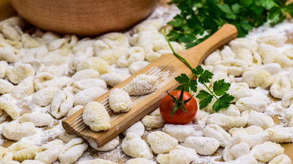 Fototapeta na wymiar Homemade gnocchi, prepared on the table with ingredients.