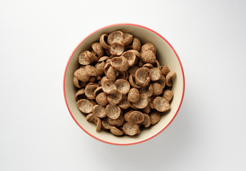 Cereals breakfast in bowl on white background.top view