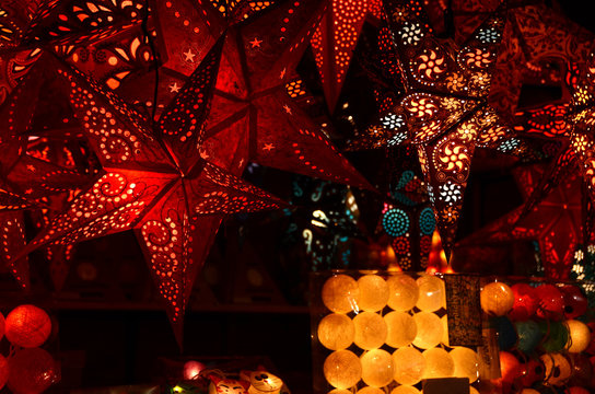 Illuminated stars handmade in the Christmas market. Italy.