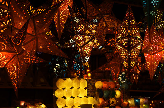 Illuminated stars handmade in the Christmas market. Italy.