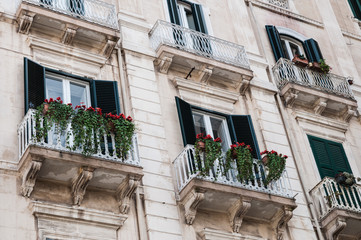 Balconies with potted plant in South Italy