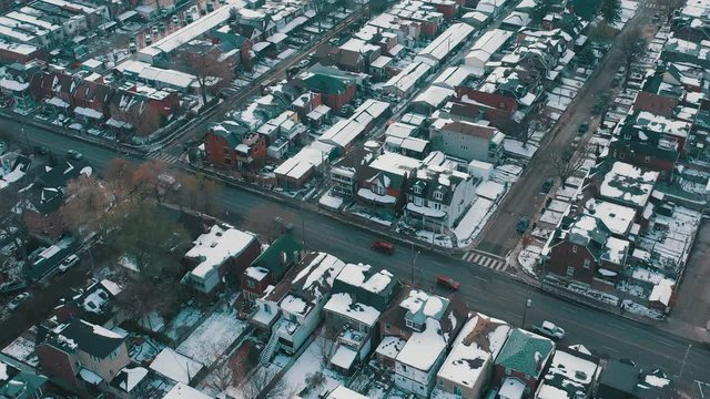 Aerial establishing shot of a Toronto neighborhood after a snowfall. Cinematic 4K footage.