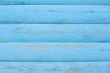 The wooden wall is blue. Background. Texture.