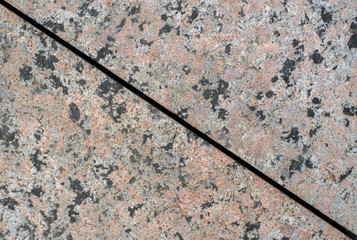 Marble texture closeup on the street. Background.