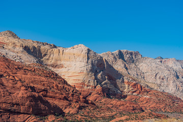 Low angle landscape pf white and orange stone hillside at Snow Canyon State Park in Utah