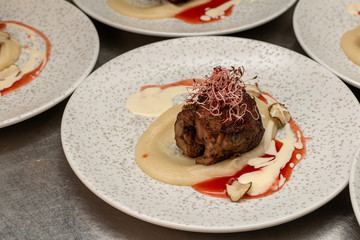 Grilled deer neck with sauce and microgreen