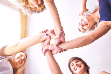 Young beautiful sportwomen doing gesture with hands