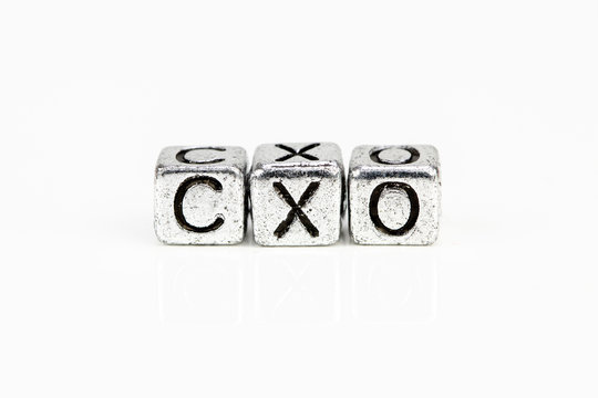 Chief Experience Officer CXO concept with cubic metal letters