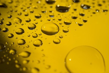 Biodiesel, bubbles biofuel, vegetable oil, yellow and orange emulsion bubbles background