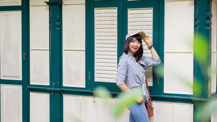 Thai woman wearing a T-shirt and jeans. Are happy in public park Bangkok Thailand