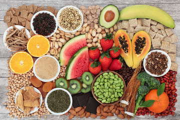 Health food for energy, vitality & fitness with fruit, vegetables, nuts, seeds, legumes, cereal  &...