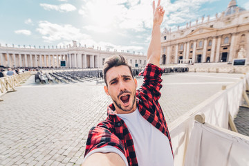 Excited man take a selfie at Vacatican City, Rome in Italy. 