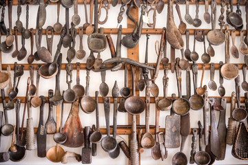 Wooden kitchen utensils hanged as decorative display on wall