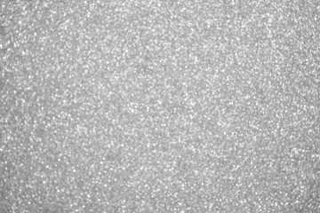 Abstract silver glitter sparkle defocused light background