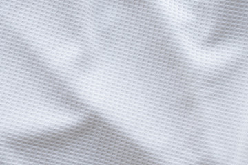 Fototapeta na wymiar White sports clothing fabric football shirt jersey texture abstract background