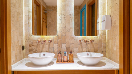 modern cafe toilet.brick walls with retro valve and mirror