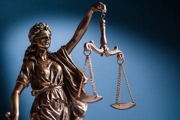 Bronze statue of Justice holding up scales